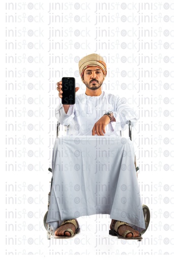 omani khaliji arab man from gulf on a wheel chair holding mobile