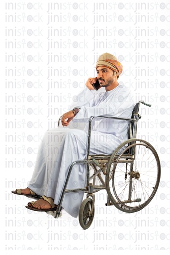 omani khaliji arab man from gulf on a wheel chair talking on the mobile