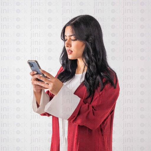 a khaliji woman with red dress holding mobile phone stock image