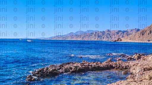A Beach, rocks, and mountains in Dahab, south Sinai, Egypt