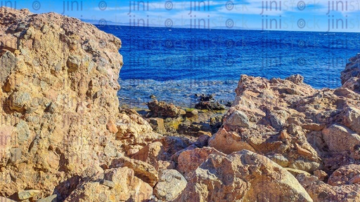 A Beach, rocks, and mountains in Dahab, south Sinai, Egypt