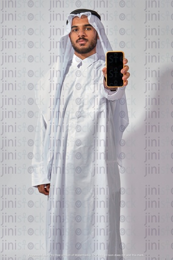 young khaliji man from qatar or Saudi holding mobile phone