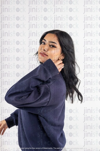 a stock image of a side Arabian woman with hands on hair on isolated background