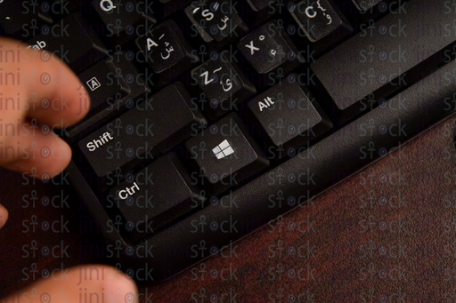 Hand above Keyboard - stock image