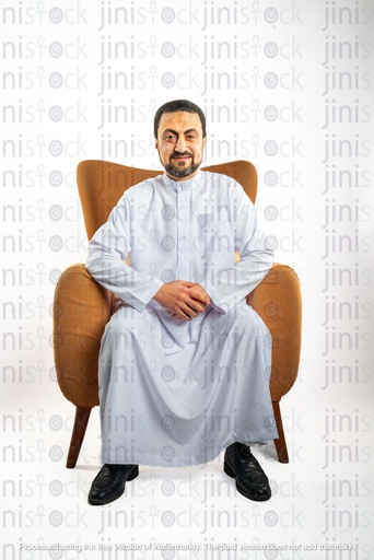 saudi khaliji man from gulf sitting on a chair and looking to the camera