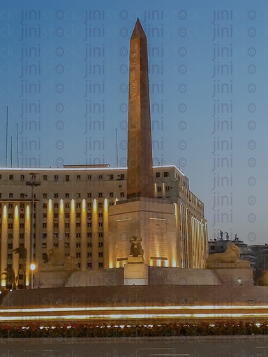 The obelisk,  The Rams,and Mogamaa Al- Tahrir,in Tahrir Square, Cairo, Egypt at night, and the Street were empty of cars, use as a background for designs on Cairo streets.