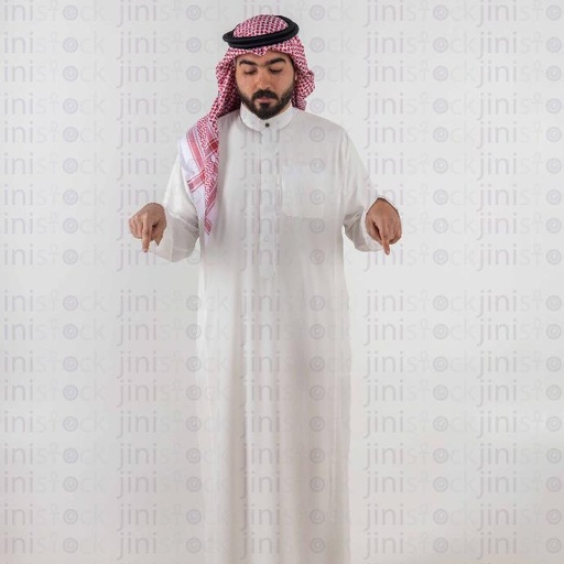 khaliji man pointing down with both hands stock image