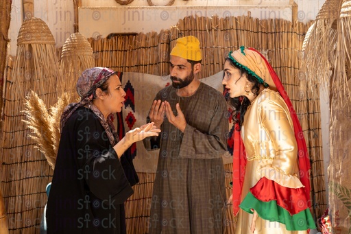 Egyptian family in peasant dress in a discussion 