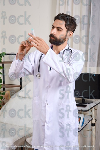A doctor prepares an injection