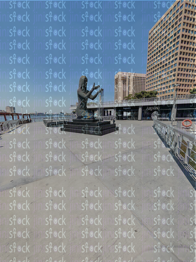 The mermaid statue from the Egyptian walkway, amidst the cafes