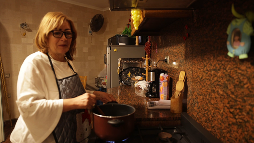 old woman cooking