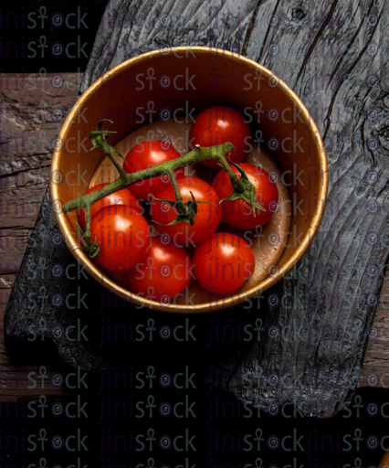 tomato in a bowl - stock image