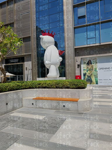 Paved terrace with white bear sculpture