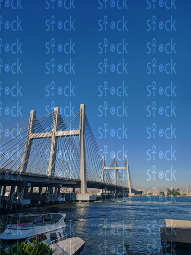 Nile Reflections Beneath Tahya Misr Bridge