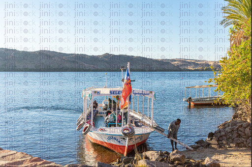 sailor anchring his boat