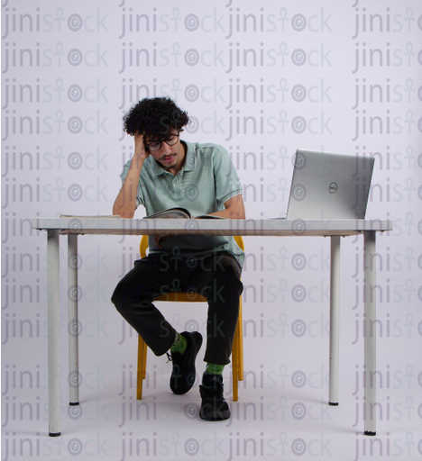 man studing and reading in a book - stock image