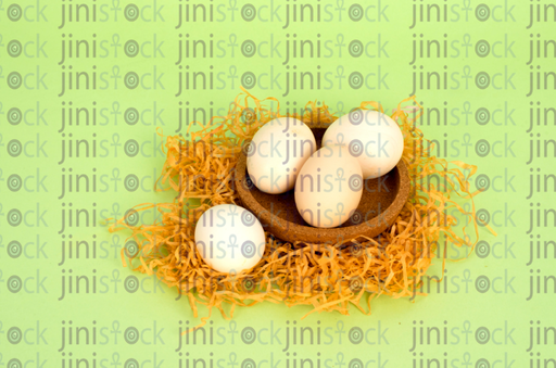 coloured eggs for Easter in a nest -stock image