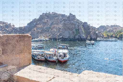 boats parked in the nile next to Philae temple
